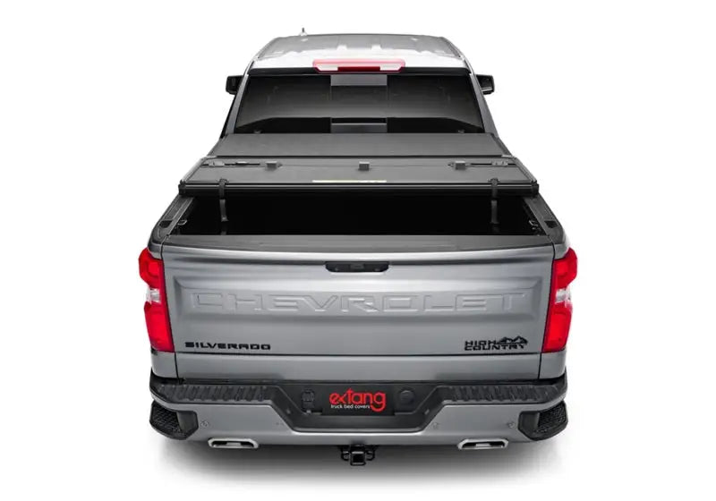 Silver pickup truck with tonneau cover featuring Extang Solid Fold ALX for Silverado 1500