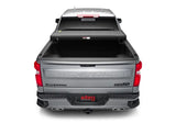 Silver pickup truck with open bed cover showcasing Extang Solid Fold ALX