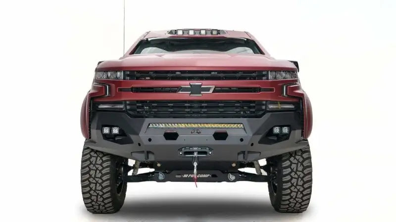 Red 2019 Chevy 1500 equipped with a Fab Fours Matrix Front Bumper (CS19-X4051-1), featuring rugged design and enhanced front-end protection.