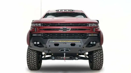 Red 2019 Chevy 1500 equipped with a Fab Fours Matrix Front Bumper (CS19-X4051-1), featuring rugged design and enhanced front-end protection.