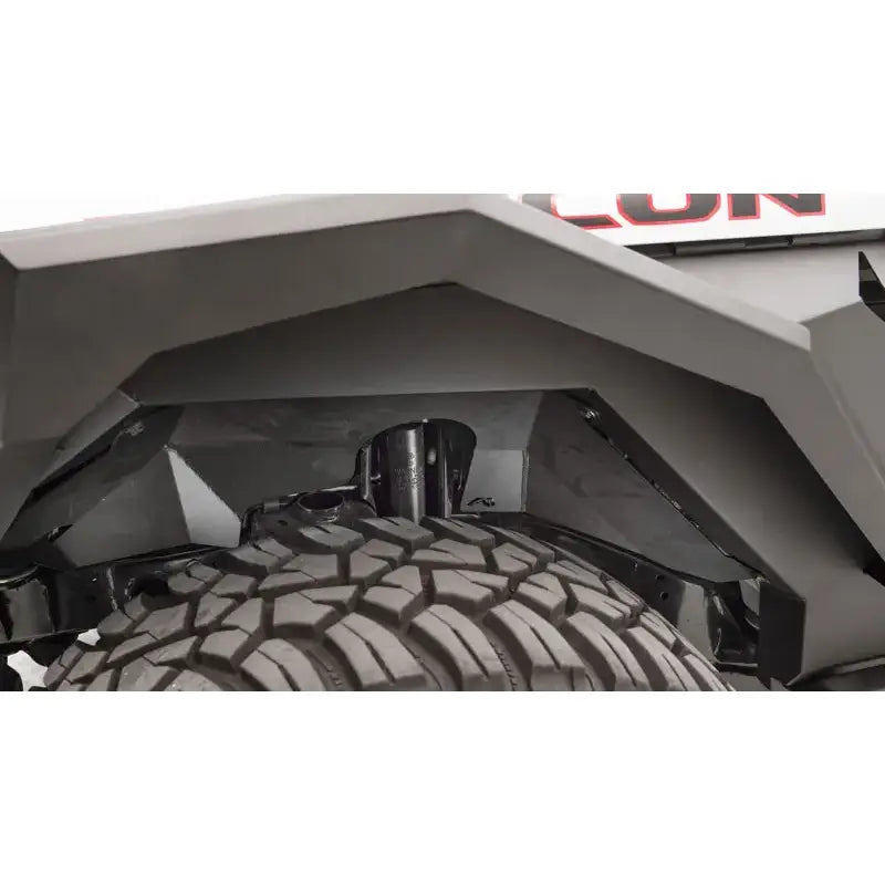 Fab Fours JL1002-1 18 Jp Jl Inner Fender on a Jeep Wrangler with rugged tire and enhanced protection.