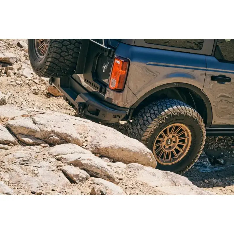 Gray off-road vehicle with fender flares and body armor for Ford Bronco