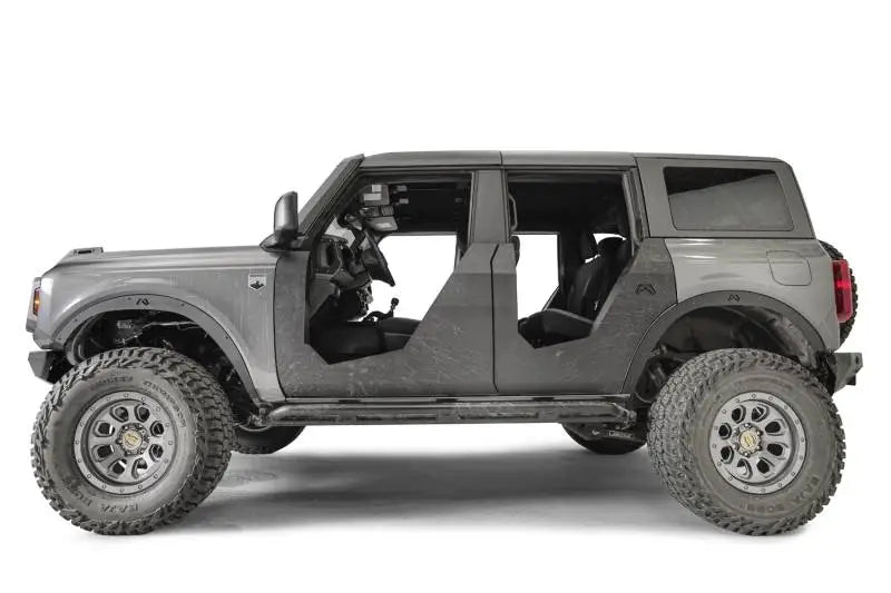 Gray four-door off-road vehicle with fab fours flare delete for rugged look