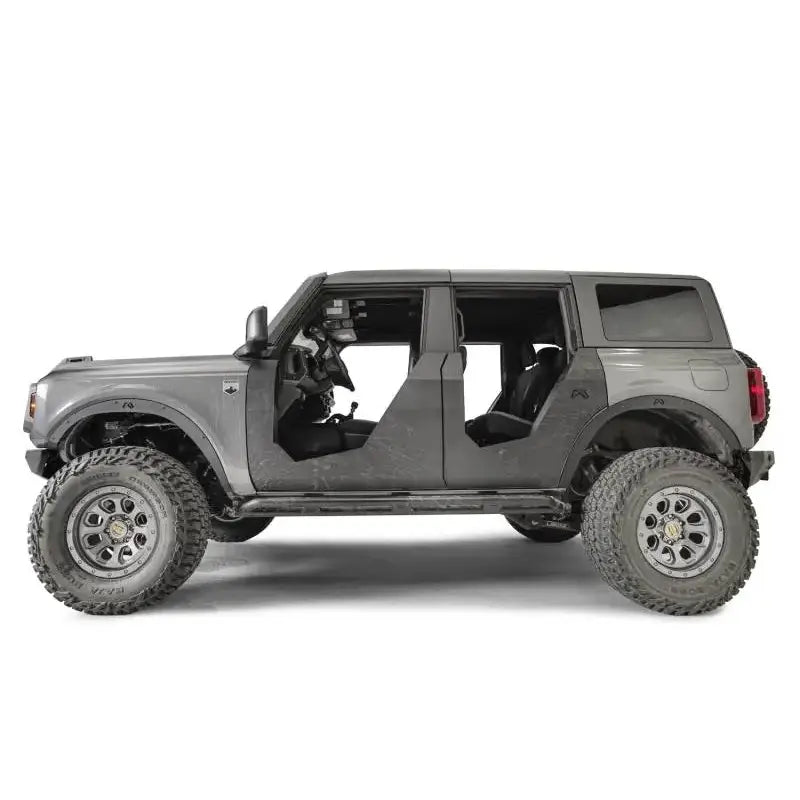 Gray four-door off-road vehicle with fab fours flare delete for rugged look