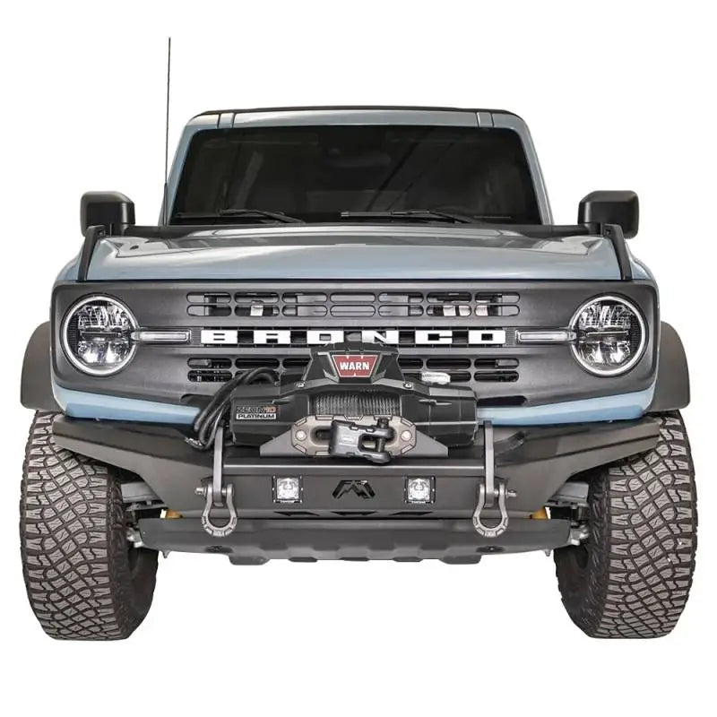 Front view of a vehicle showcasing the FB21-B5252-1 Fab Fours Stubby Front Bumper with a rugged design and high-quality construction.