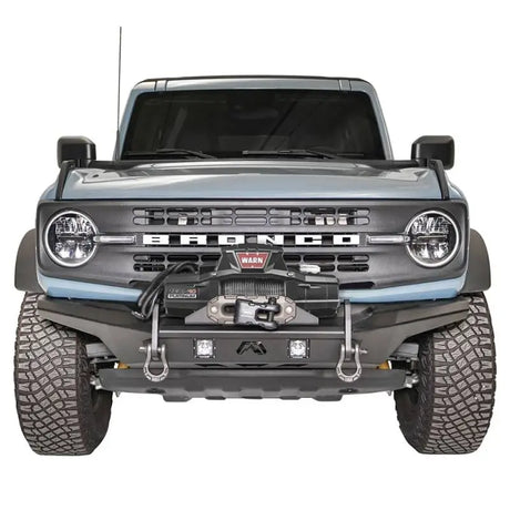 Front view of a vehicle showcasing the FB21-B5252-1 Fab Fours Stubby Front Bumper with a rugged design and high-quality construction.