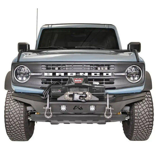 Front view of a vehicle showcasing the FB21-B5252-1 Fab Fours Stubby Front Bumper with a rugged design and high-quality construction.