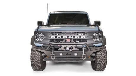 FB21-B5252-1 Fab Fours Stubby Front Bumper on a front view of a blue off-road vehicle