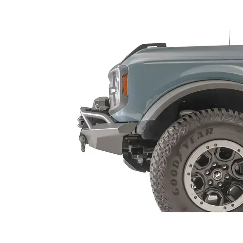 FB21-B5252-1 Fab Fours Stubby Front Bumper enhancing vehicle's rugged appearance and durability on rough terrain.