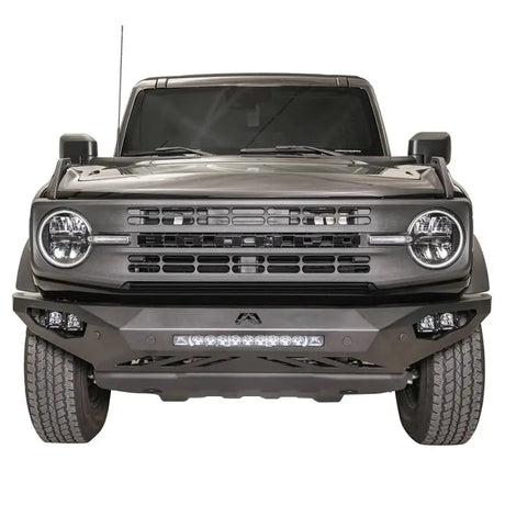 FB21-D5251-1 Fab Fours Vengeance Front Bumper mounted on a rugged, aggressive off-road vehicle, showcasing unparalleled protection and durability.