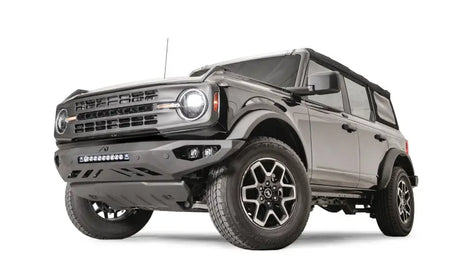 FB21-D5251-1 Fab Fours Vengeance Front Bumper installed on a rugged off-road vehicle, showcasing its aggressive, durable design for tough off-road conditions.