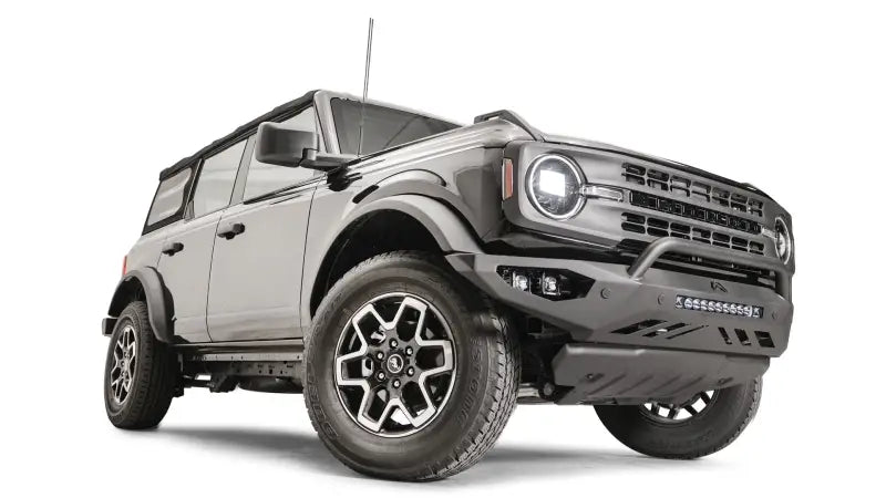 FB21-D5252-1 Fab Fours Vengeance Front Bumper on a rugged off-road vehicle, showcasing heavy-duty construction and aggressive styling.