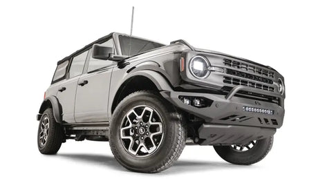 FB21-D5252-1 Fab Fours Vengeance Front Bumper on a rugged off-road vehicle, showcasing heavy-duty construction and aggressive styling.