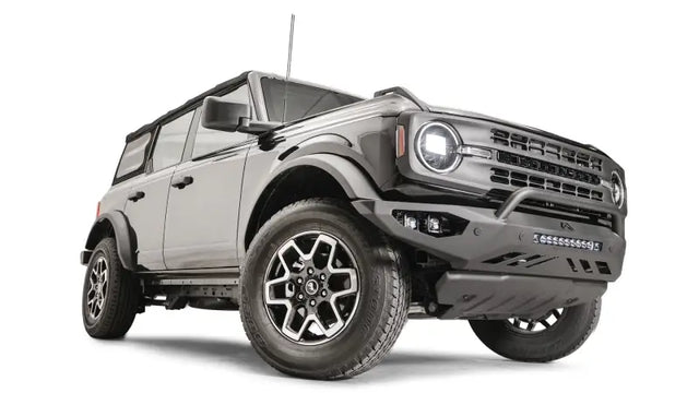FB21-D5252-1 Fab Fours Vengeance Front Bumper on a rugged off-road vehicle, showcasing heavy-duty construction and aggressive styling.