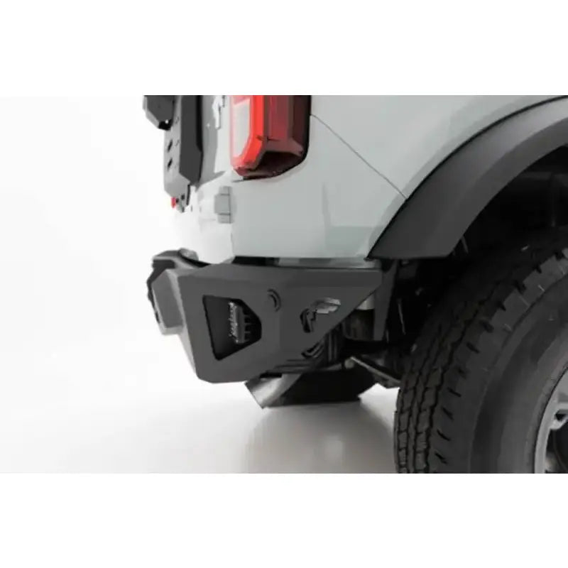 Fab Fours Vengeance Rear Bumper FB21-E5251-1 installed on a vehicle, showcasing its rugged design and superior protection.