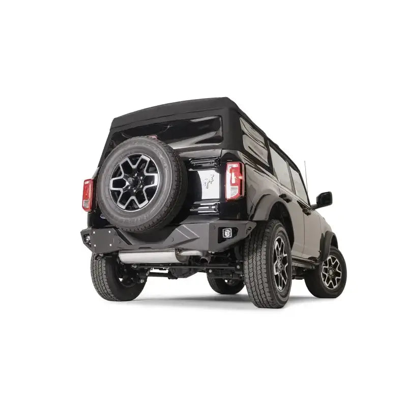 FB21-E5251-1 Fab Fours Vengeance Rear Bumper on a rugged off-road vehicle flaunting enhanced rear-end protection and aggressive styling.