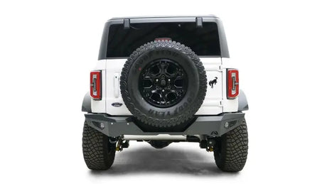 Rear view of a white 2021-2022 Ford vehicle with a mounted spare tire, featuring the sturdy FB21-Y5252-1 Fab Fours rear bumper for enhanced protection and style.