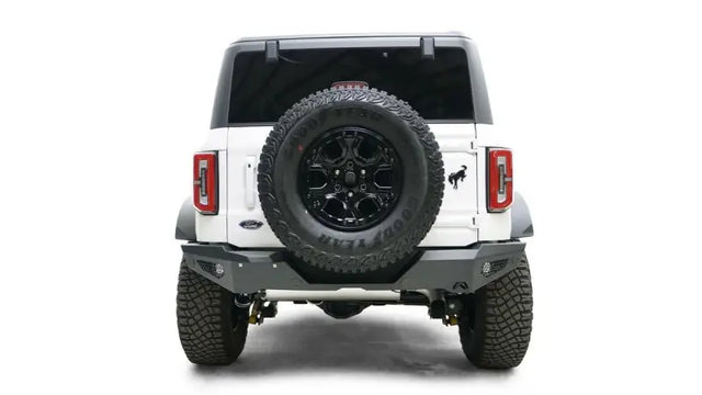 Rear view of a white 2021-2022 Ford vehicle with a mounted spare tire, featuring the sturdy FB21-Y5252-1 Fab Fours rear bumper for enhanced protection and style.