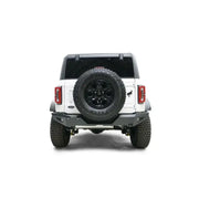 Rear view of a white 2021-2022 Ford vehicle with a mounted spare tire, featuring the sturdy FB21-Y5252-1 Fab Fours rear bumper for enhanced protection and style.