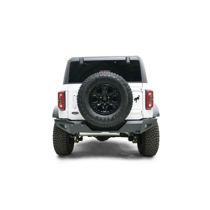 Rear view of a white 2021-2022 Ford vehicle with a mounted spare tire, featuring the sturdy FB21-Y5252-1 Fab Fours rear bumper for enhanced protection and style.
