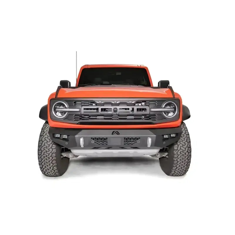 Orange Ford Bronco with Fab Fours Vengeance Front bumper for rugged style