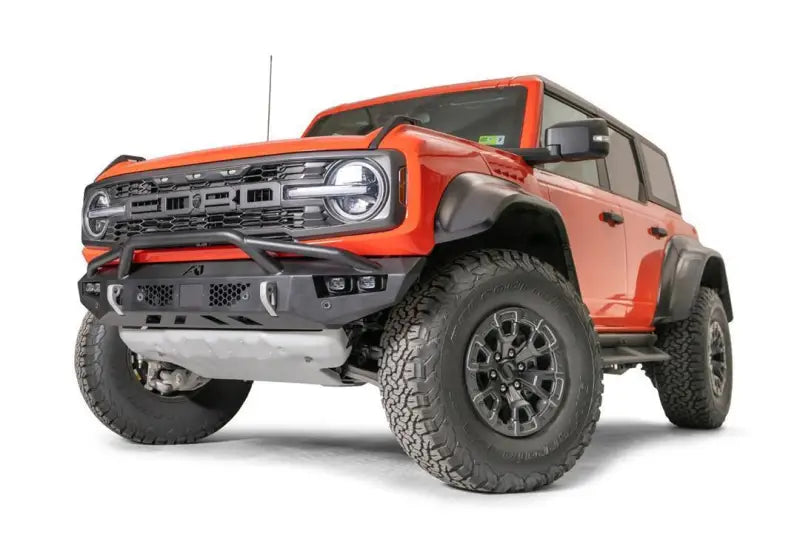 "FBR22-D5752-1 Fab Fours Vengeance Front bumper on a rugged off-road vehicle, showcasing a sleek and aggressive design with enhanced front-end protection for tough conditions."