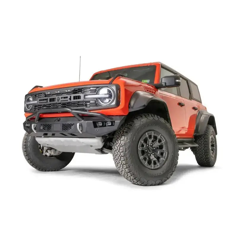 "FBR22-D5752-1 Fab Fours Vengeance Front bumper on a rugged off-road vehicle, showcasing a sleek and aggressive design with enhanced front-end protection for tough conditions."