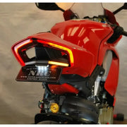 Fender Eliminator Duc with LED tail light and side mount license plate kit on a red motorcycle rear view showcasing installation and sleek design.