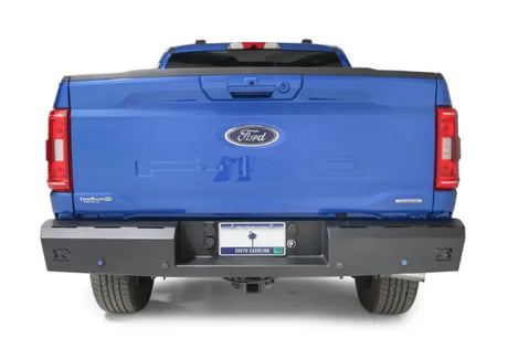 Blue Ford pickup truck with Fab Fours Red steel rear bumper accessory