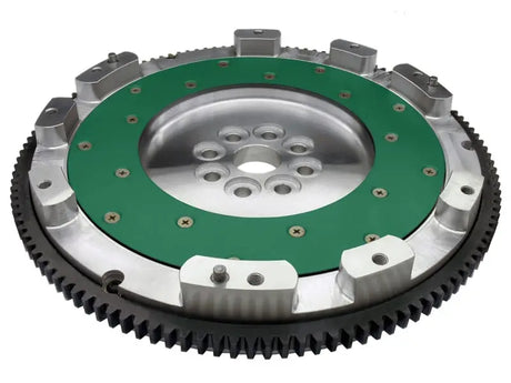 Heavy-duty STI aluminum flywheel with green friction surface and black ring gear