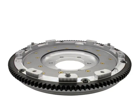 Silver and black automotive clutch assembly with outer gear ring for RX-7’s performance
