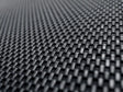 Woven black textured material on custom fit carbon fiber style floor liners