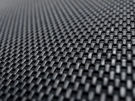 Woven black textured material on custom fit carbon fiber style floor liners