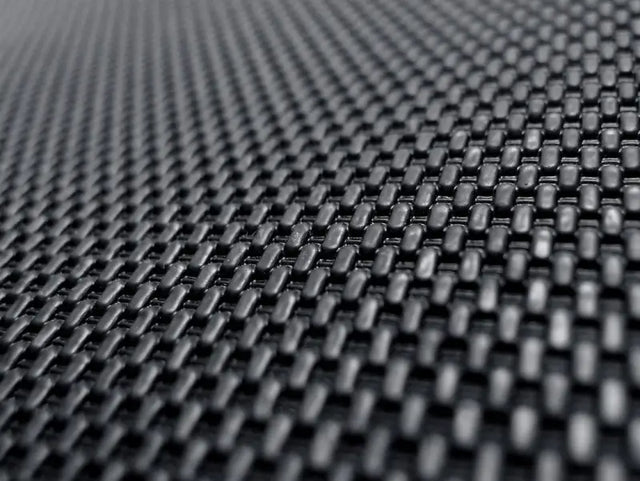 Woven black textured material on custom fit carbon fiber style floor liners