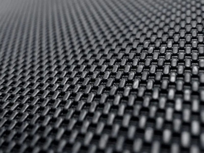 Woven black textured material on custom fit carbon fiber style floor liners