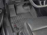 Black floor liner molded fit with channels and reservoir for fluids WeatherTech logo
