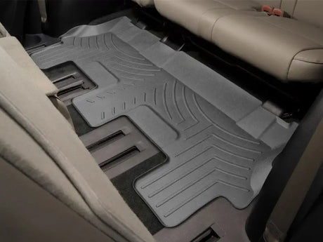 Gray molded fit car floor liner with channels and reservoir for vehicle’s interior protection