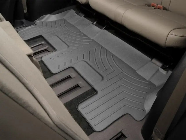 Gray molded fit car floor liner with channels and reservoir for vehicle’s interior protection