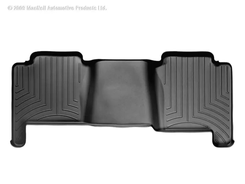 Black molded floor liner with channels and reservoir for fluids from WeatherTech