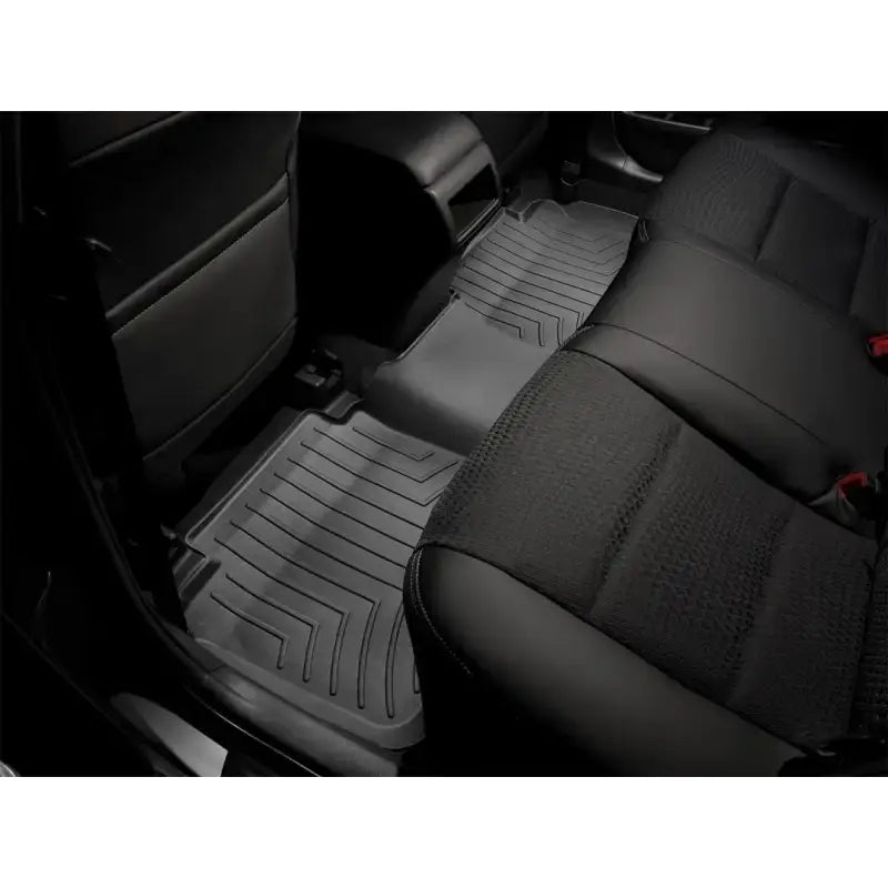 Gray car floor liner molded fit with channels and reservoir for fluids, WeatherTech logo