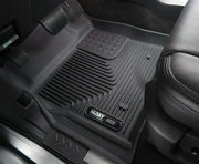 Black Husky Liners floor liner with molded fit, raised channels, and edges for trucks and SUVs, made from thermoplastic elastomer (TPE).