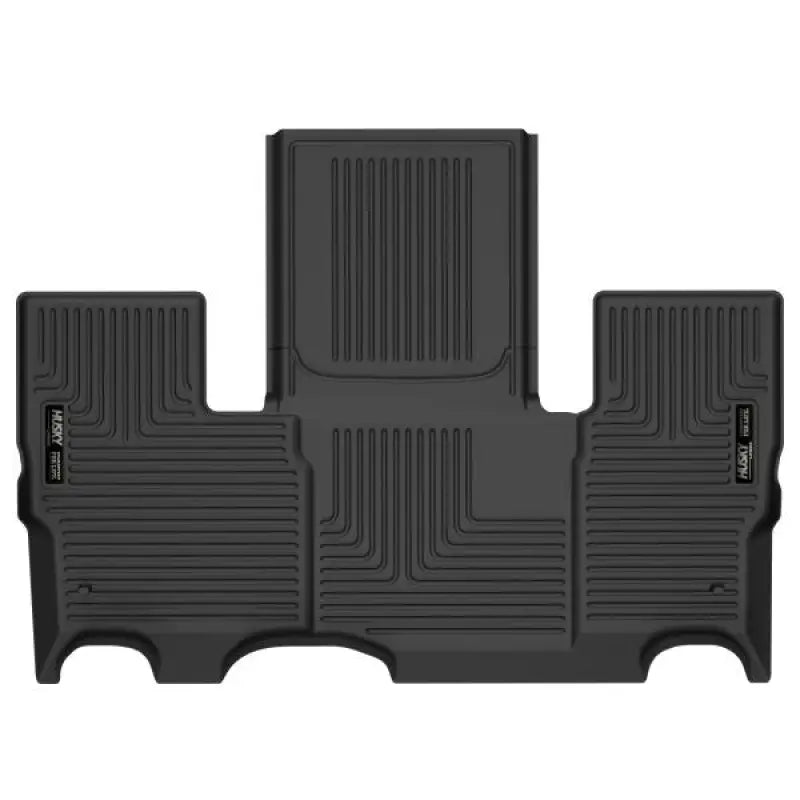 Black Thermoplastic Elastomer (TPE) floor liner with raised ridge, molded fit, and exclusive StayPut Cleats™ by Husky Liners X-act Contour for trucks and SUVs.