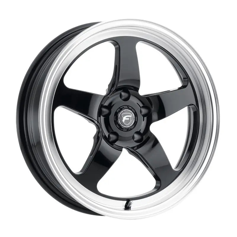 Black five-spoke wheel with silver rim.