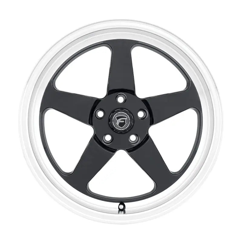 Black five-spoke wheel with silver rim.