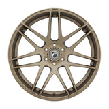 Bronze-colored car wheel.