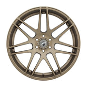 Bronze-colored car wheel.