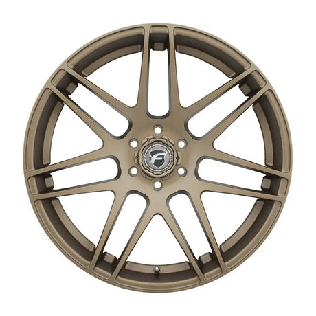 Bronze-colored car wheel.
