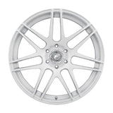 Silver multi-spoke car wheel.