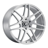 Silver car wheel with multi-spoke design.