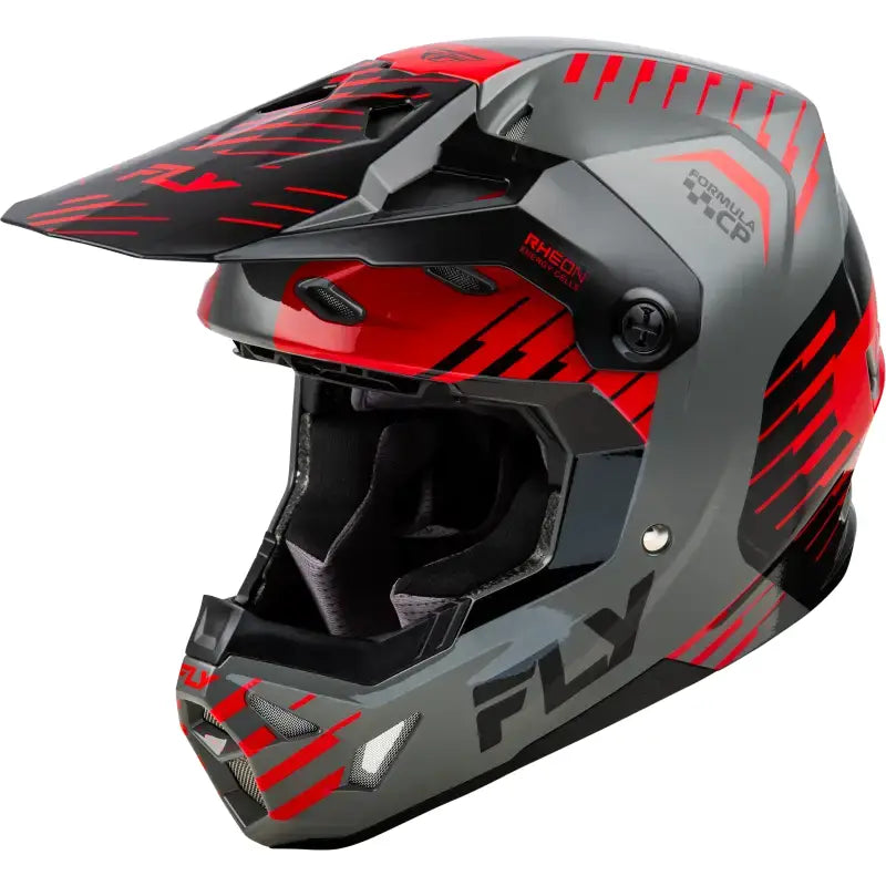 Gray and red motocross helmet with impact energy cells for better impact energy absorption